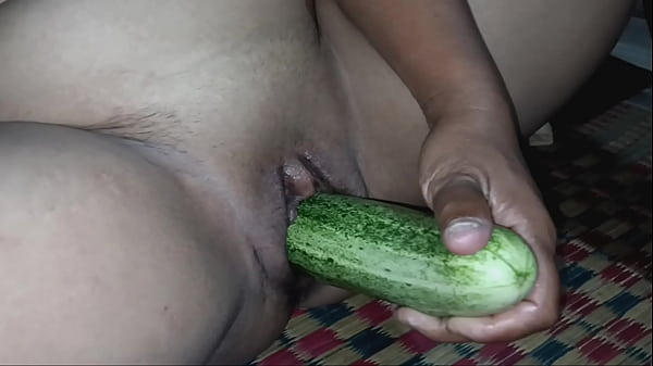 Spreading her pussy and stuffing cucumbers in her clit until she cums.