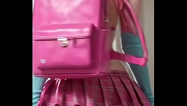 Naughty girl with a backpack and short skirt doing a little dance. – Free HD Porn Video