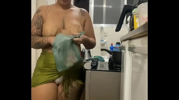 DOING LIVE IN THE KITCHEN IN A MINI SKIRT SHOWING HER FAT PUSSY