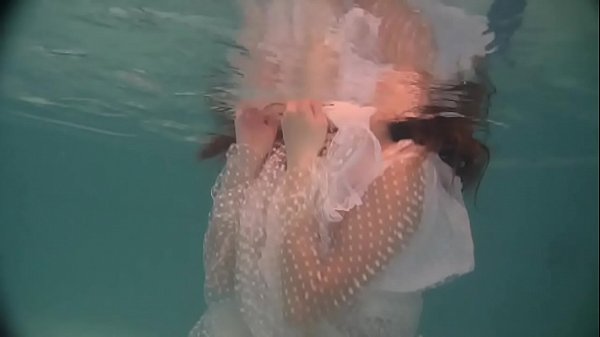 Russian naked babe Natalia swims and strips