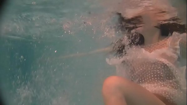 Russian naked babe Natalia swims and strips