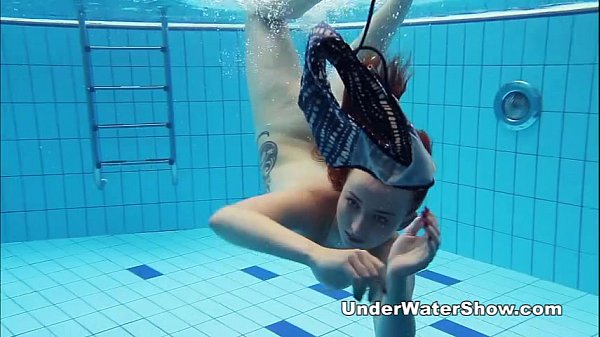 Redheaded cutie swimming nude in the pool – Free HD Porn Video